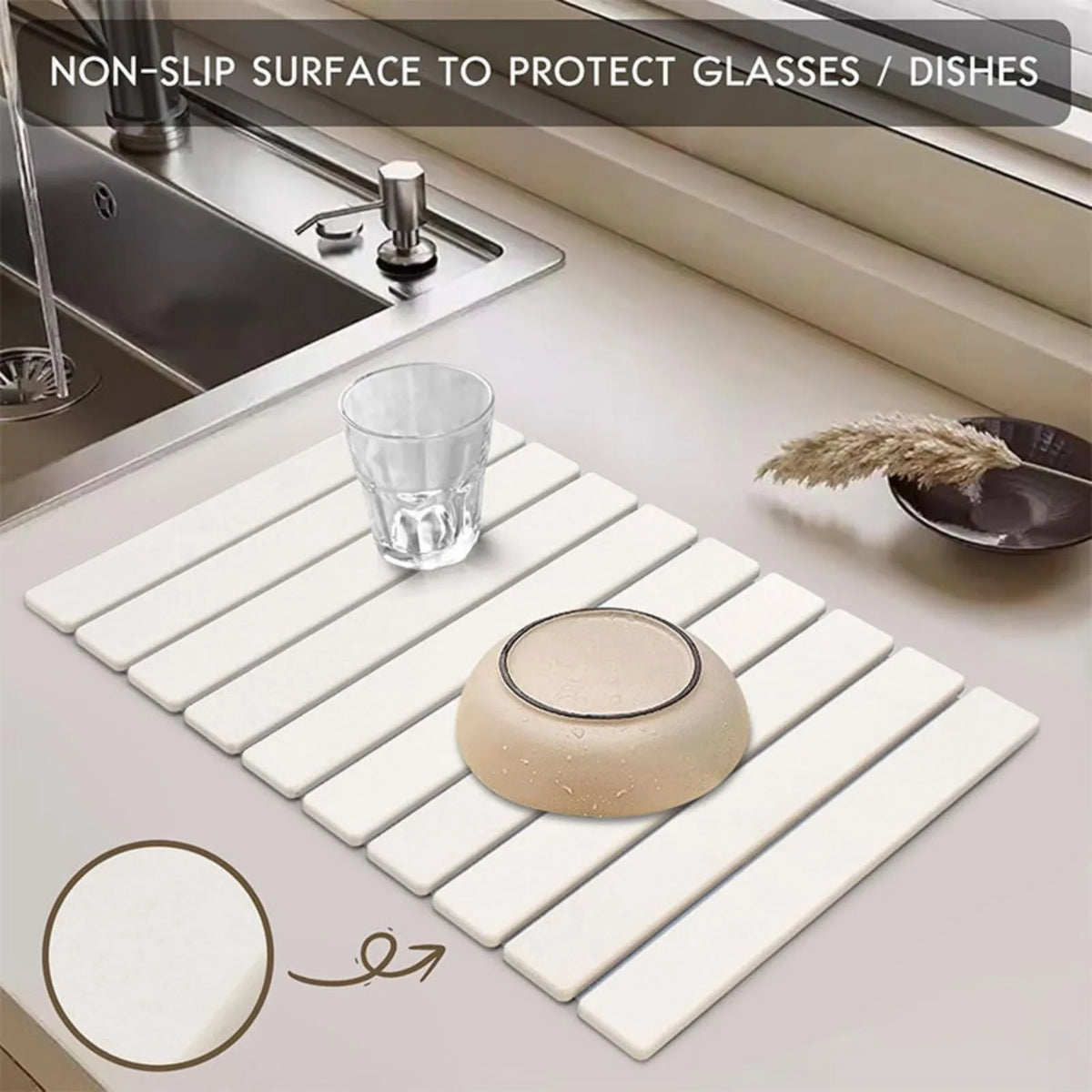 Stone dish drying mat with glasses beside a sink