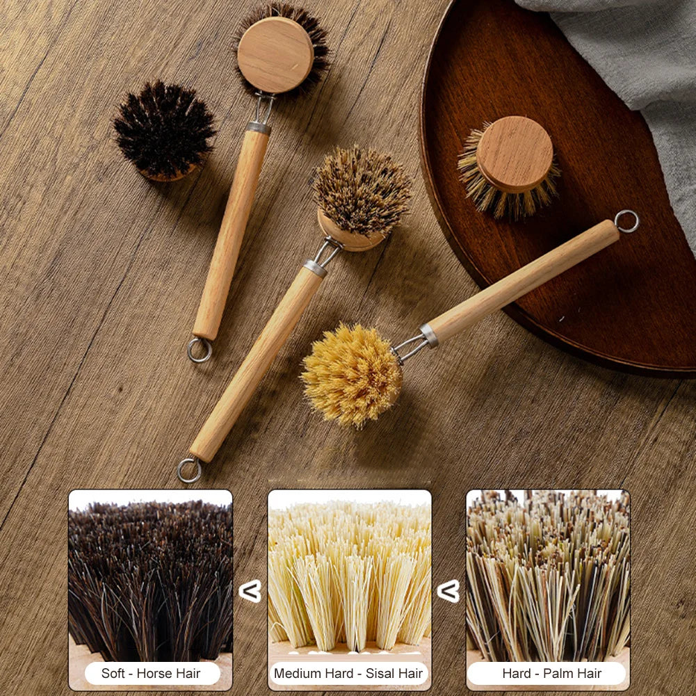 Wooden dish brushes and replacement heads on a wooden tray