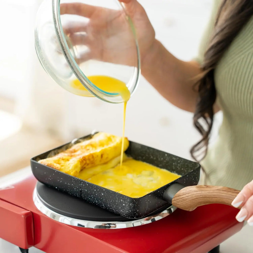 Pouring egg into a rectangular tamagoyaki pan