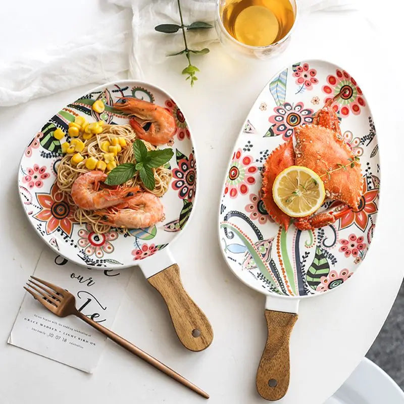 Floral ceramic serving plate with a handle