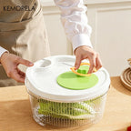 Hands using a green salad spinner