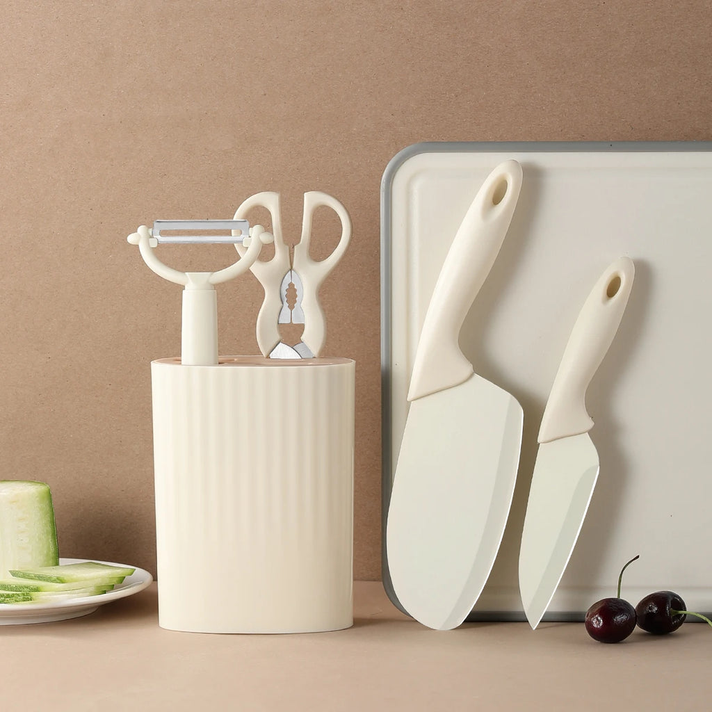 Beige five-piece knife and scissors set in its holder