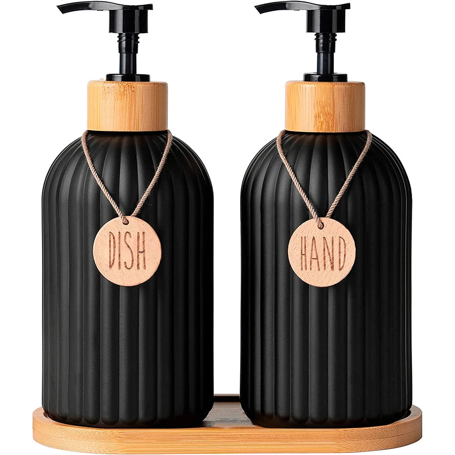 Two black ribbed soap dispenser bottles on a wooden tray