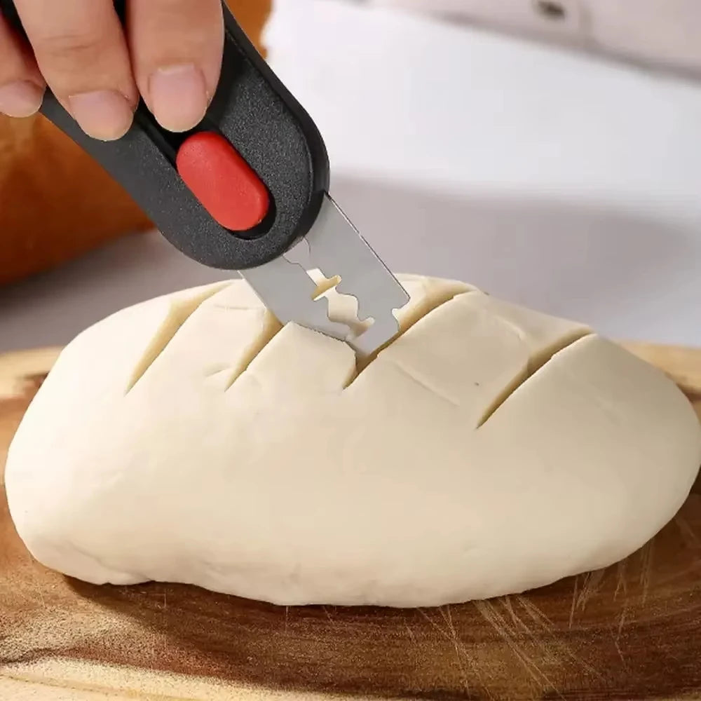 Bread scoring lame cutting a pattern into sourdough