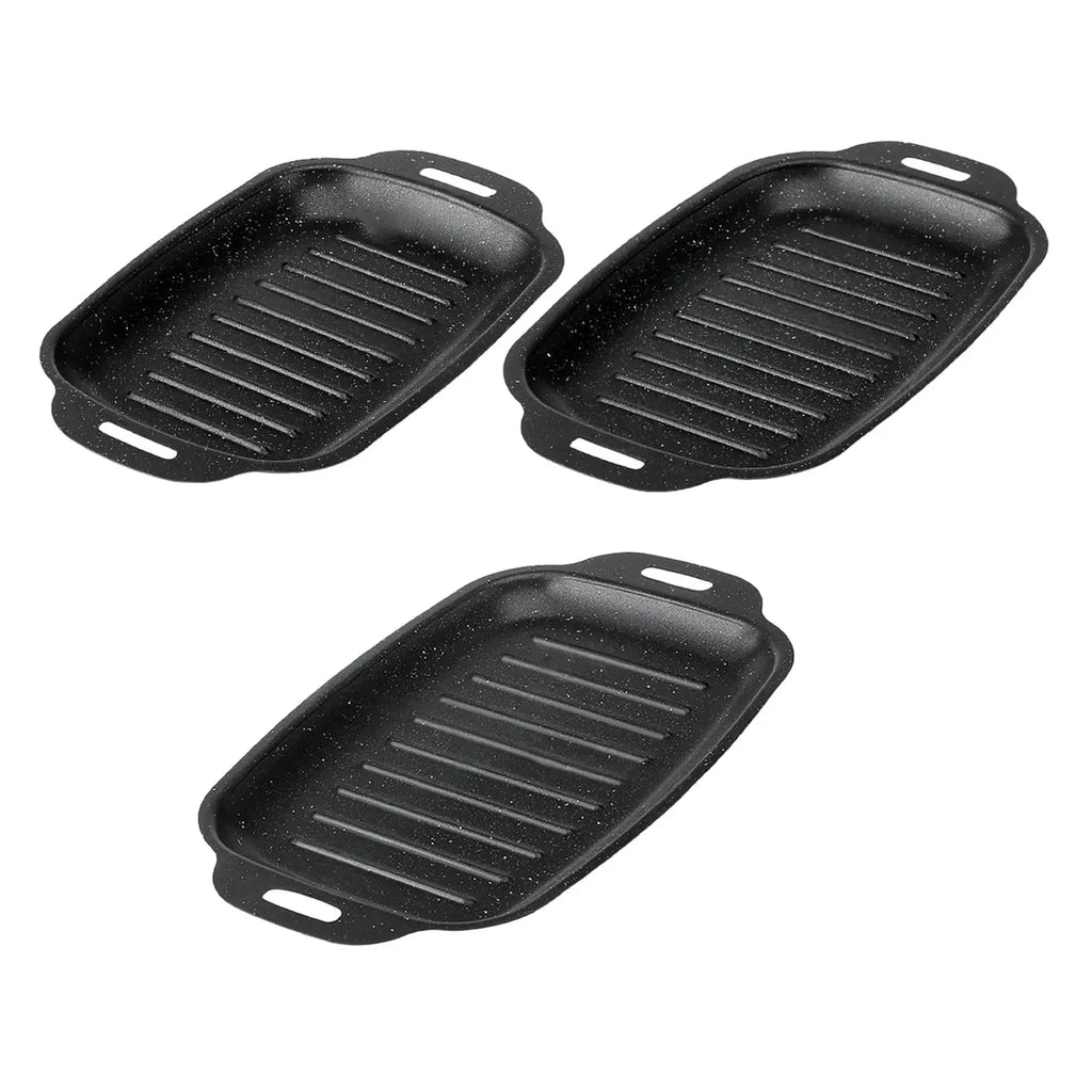 Three black rectangular ridged grill pans