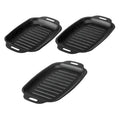 Three black rectangular ridged grill pans