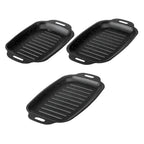 Three black rectangular ridged grill pans