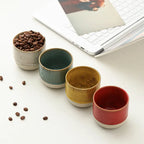 Ceramic coffee cups in five colours