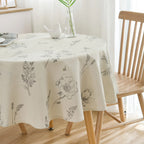 Round table with a botanical print tablecloth