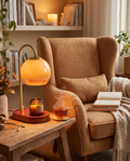 Candle warmer lamp styled beside an armchair