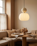 Nordic pumpkin pendant light styled above a dining nook