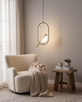 Magpie pendant light styled above a reading corner