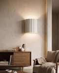 Nordic resin wall lamp styled on a textured wall