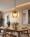 Modern glass pendant light styled above a dining table