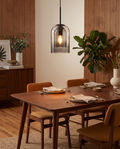 Mica mid-century double glass pendant lamp styled above a dining table