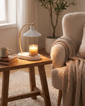 Vanessa candle warmer lamp styled beside an armchair