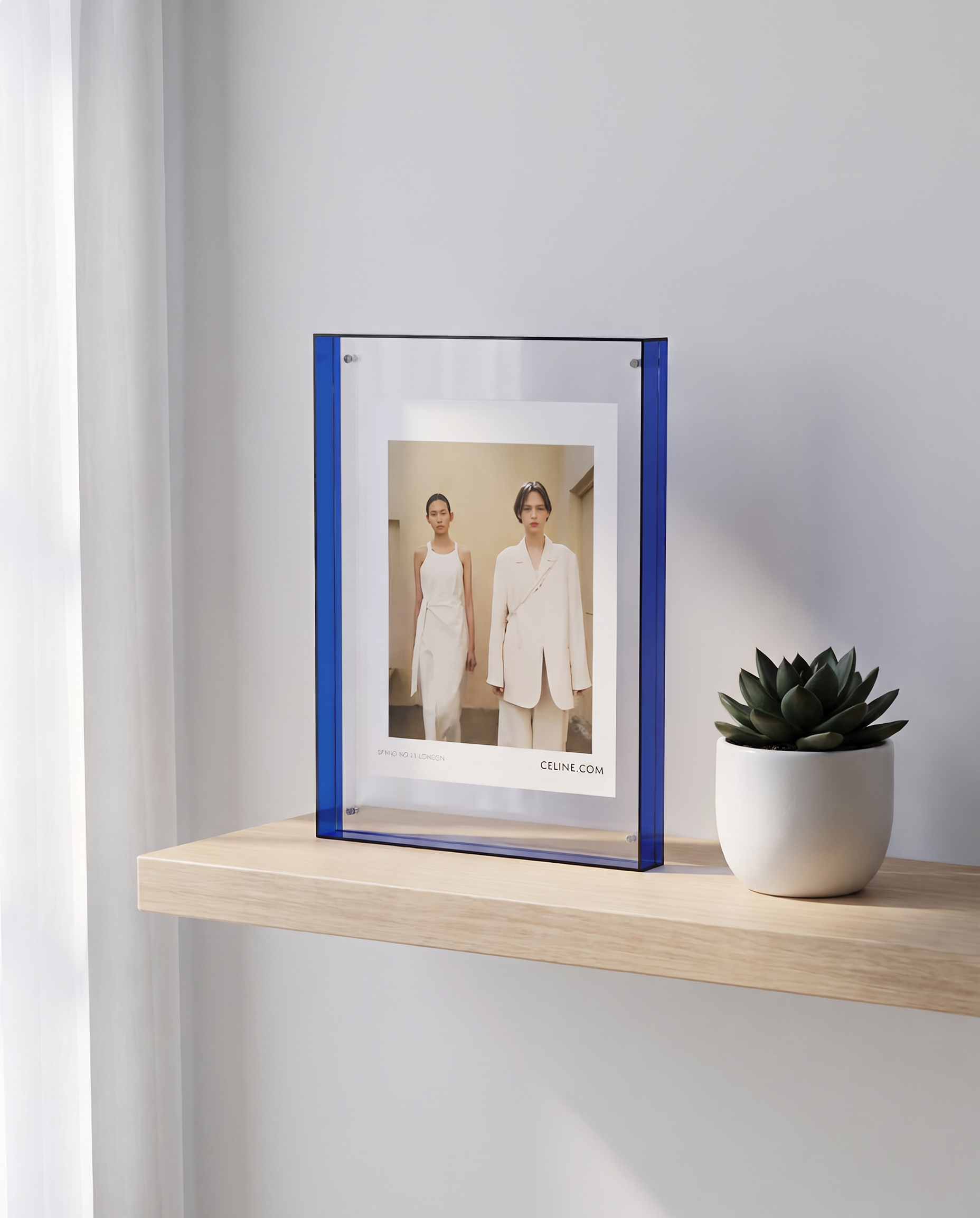 Acrylic photo frame styled on a minimalist shelf
