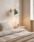 Wood and iron macaron wall sconce styled in a minimalist bedroom