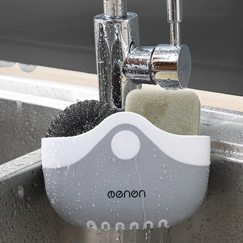 Sink caddy holding a sponge and scrubber